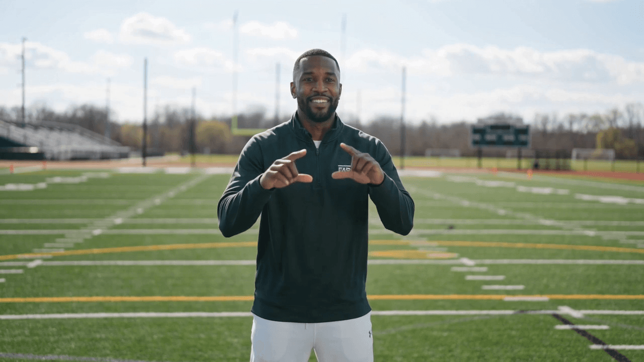 Catch triangle drill demonstration frame from the AI-generated football coaching clip