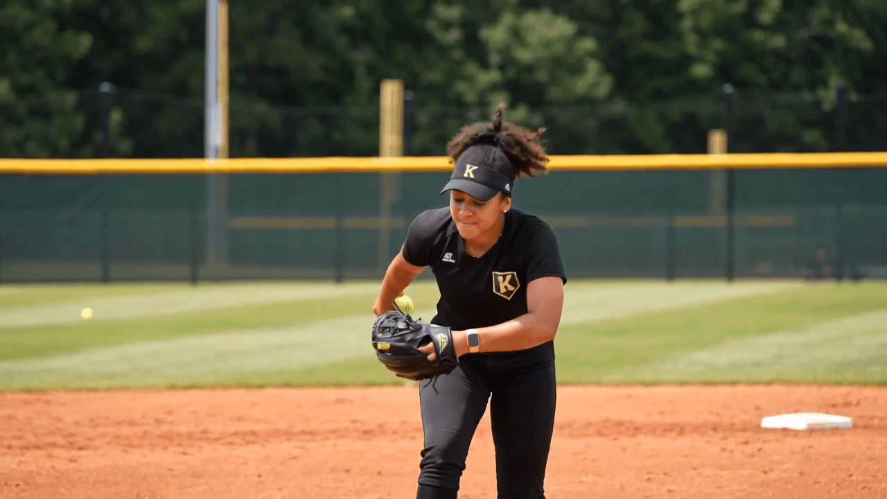 Windmill pitching drill demonstration frame from the AI-generated softball coaching clip